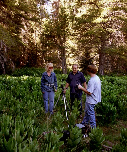 Left to right, Kim Sweet, Tim Sweet, and Josh Patterson setting up for a shoot under the Lodge Pole pine for an episode of the Big Bear History show.
